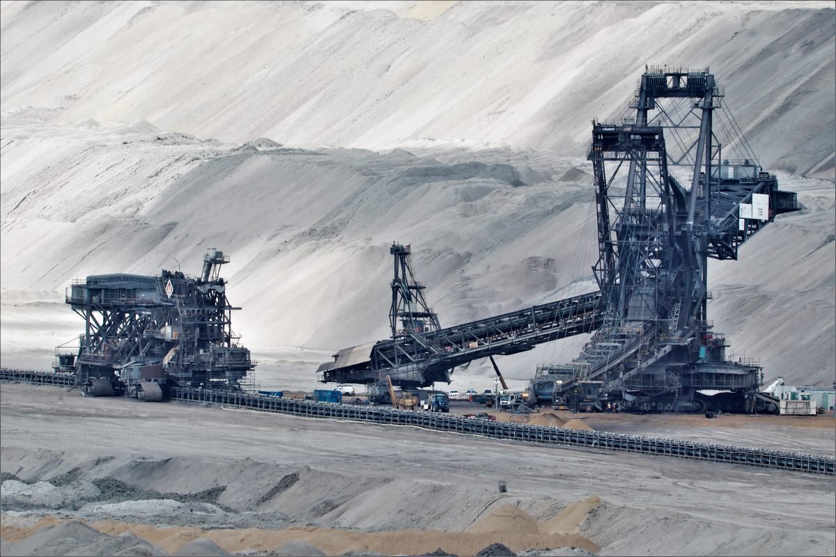 Large bucket-wheel excavators and conveyor systems at a surface mine